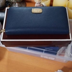 Blue Michael Kors purse with gold accent